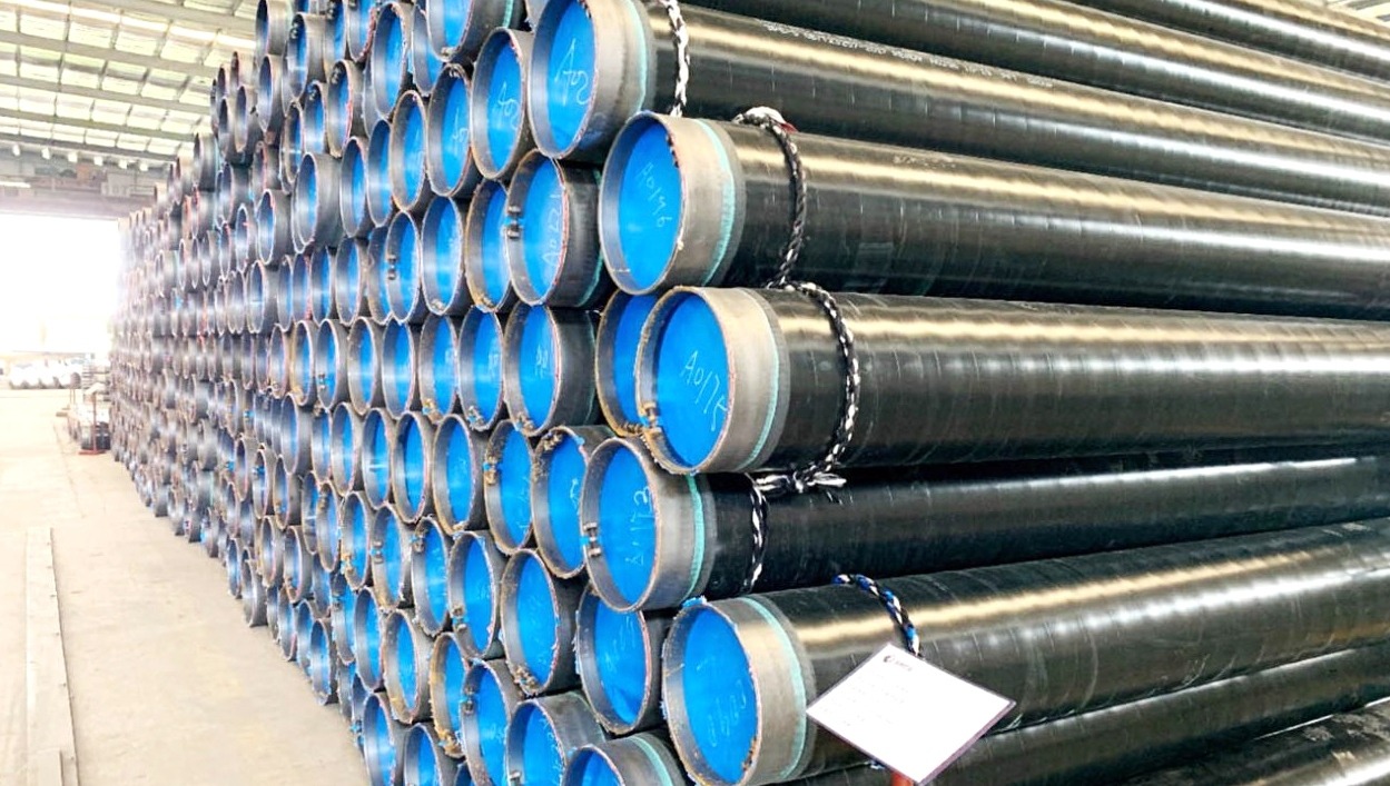 Coated pipeline inventory stacked with inspection tags